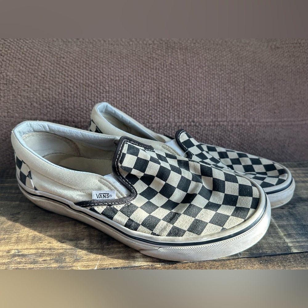 Black and white slip on vans